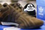 Ventes solides d'Adidas au 2e trimestre, objectif 2011 relev�